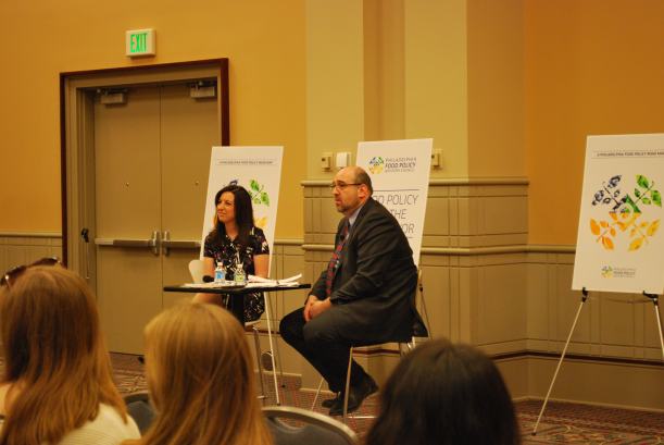 Candidate Melissa Murray Bailey and moderator Jon Deutsch listen to a question from the audience