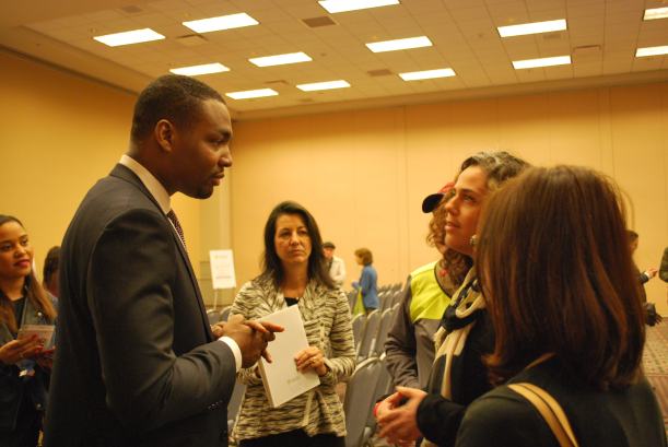 Candidate Doug Oliver chats with attendees after the forum
